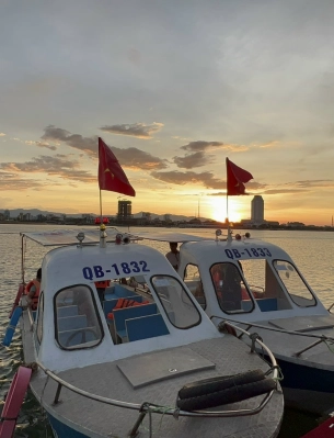 Watching the Sunset Over Nhật Lệ River